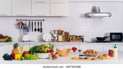 healthy and vegetarian foods background and banner of assortment of fruits, vetgetables and eggs on white table in kitchen - Powered by Shutterstock