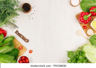 Healthy Vegetarian Ingredients For Spring Fresh Green Salad And Kitchenware On White Wood Board, Top View, Copy Space.