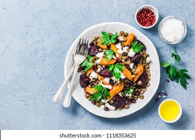 Healthy vegetarian salad, roasted root vegetables, lentils and feta cheese.Top view, space for text. - Powered by Shutterstock