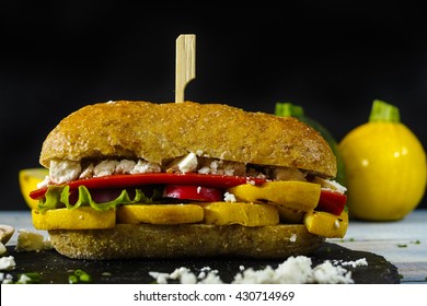 Healthy Vegetarian Veggie Sandwich With  Grilled Yellow Squash Zuccini, Mushrooms, Paprika, Salad, Feta Cheese On Blue Table Top