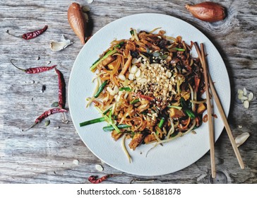 Healthy Vegetarian/vegan menu; Padthai noodle with smoke tofu and mixed vegetable - sprout, carrot, garlic chive, shallot and radish) with crushed peanut, sunflowers,  pumpkin seeds and dried raisin