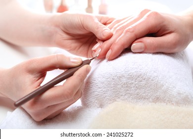 Healthy, Well Groomed Nails, Natural Beauty. Treatment Hand And Nail Care, The Woman To A Beautician For A Manicure. 