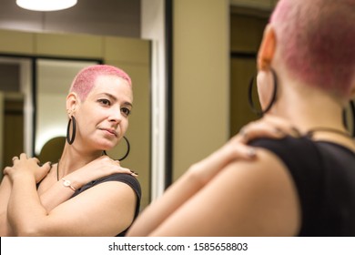 Healthy Woman After Chemotherapy Looks In Mirror At Herself With Love And Hope. Girl With Short Hair. Self Love And Health. Body Positive