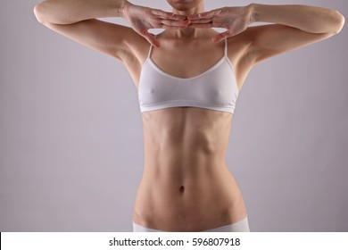 Healthy woman body, torso, slim waist, belly, abdomen close up. Sport, fitness, Dieting results. Female Armpit after depilation, smooth clean skin. Waxing, laser hair removal treatment.