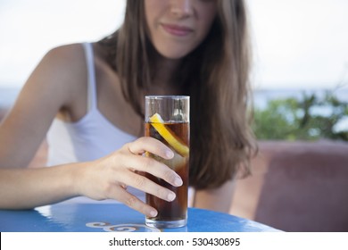 Healthy Woman Drinking A Iced Tea On A Summer Day