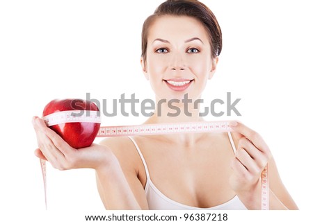 healthy woman with red apple and measure on white background