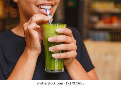 Healthy Woman Taking Her Green Detox Juice.