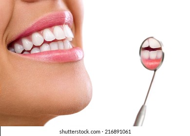 Healthy Woman Teeth And A Dentist Mouth Mirror 