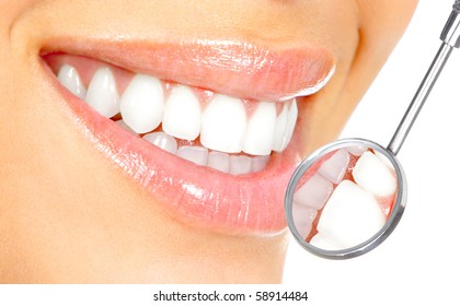 Healthy Woman Teeth And A Dentist Mouth Mirror