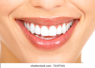 Healthy woman teeth and smile. Close up.