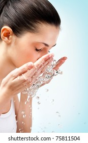 healthy woman washing her face