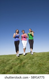 Healthy Women Jogging Together Outdoors