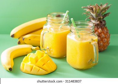 Healthy Yellow Smoothie With Mango Pineapple Banana In Mason Jars