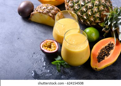 Healthy Yellow Smoothie With Tropical Fruits, Pineapple, Papaya And Passion Fruit, Exotic Vitamin Drink