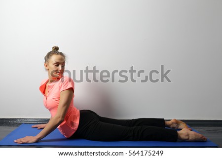 Healthy yoga woman in cobra pose, improves spinal operation