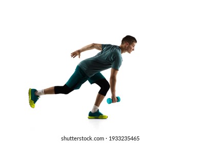 Healthy. Young caucasian male model in action, motion isolated on white background with copyspace. Concept of sport, movement, energy and dynamic, healthy lifestyle. Training, practicing. Authentic.