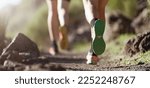 Healthy young couple running on mountain trail in morning. Trail running marathon fitness feet on rock fitness and healthy lifestyle