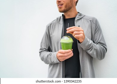 Healthy Young Man Drinking Green Juice Smoothie Cup As Weight Loss Detox Meal Replacement Diet. Spinach Protein Shake For Morning Breakfast.