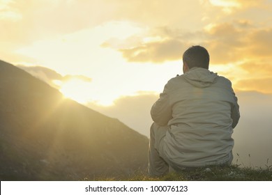 healthy young man practice yoga in height mountain at early morning and sunrise - Shutterstock ID 100076123