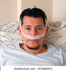 Healthy Young Man Wearing Under The Nose Nasal Mask And Using Cpap Machine. Sleep Apnea Therapy.