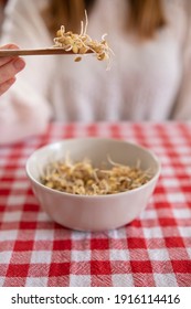 Healthy Young Woman Eating Lentil Sprouts.Healty Food,protein-rich Food.