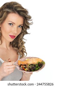 Healthy Young Woman Eating Salmon And Bean Salad