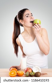 Healty Young Woman Eating An Apple. Healthy Food Concept.