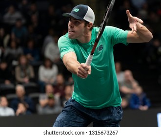 Heampstead, NY - February 17, 2019: Reilly Opelka Of USA Returns Ball During Final Of New York Open ATP 250 Tournament Against Brayden Schnur Of Canada At Nassau Coliseum