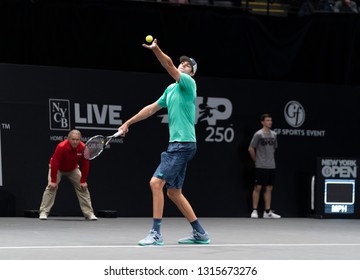 Heampstead, NY - February 17, 2019: Reilly Opelka Of USA Serves During Final Of New York Open ATP 250 Tournament Against Brayden Schnur Of Canada At Nassau Coliseum