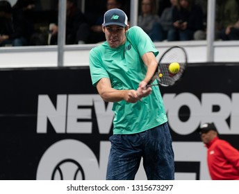 Heampstead, NY - February 17, 2019: Reilly Opelka Of USA Returns Ball During Final Of New York Open ATP 250 Tournament Against Brayden Schnur Of Canada At Nassau Coliseum