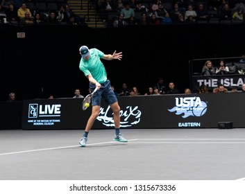 Heampstead, NY - February 17, 2019: Reilly Opelka Of USA Returns Ball During Final Of New York Open ATP 250 Tournament Against Brayden Schnur Of Canada At Nassau Coliseum