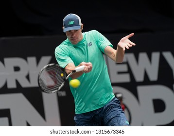 Heampstead, NY - February 17, 2019: Reilly Opelka Of USA Returns Ball During Final Of New York Open ATP 250 Tournament Against Brayden Schnur Of Canada At Nassau Coliseum