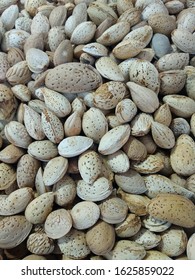 A Heap Of Almond Before Cracking The Shell / Hull. Background  / Texture / Backdrop 