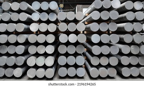 Heap of aluminium bar in aluminum profiles factory.Billets of aluminium - Shutterstock ID 2196194265