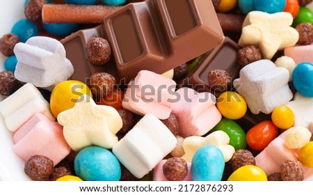 Heap of assorted tasty candy as confectionery background