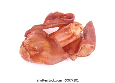 A Heap Of Big Dried Smoked Pig Ears To Be Used As Dog Treats. Image Isolated On White Studio Background.