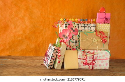 Heap Of Birthday Presents And Caption Happy Birthday,personal Gift And Bunch Of Flowers.Personal Holiday Concept, Free Copy Space