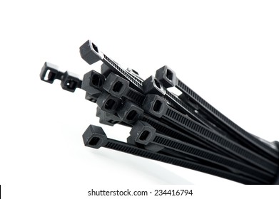 Heap Of Black Cable Ties On White Background