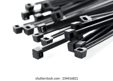 Heap Of Black Cable Ties On White Background