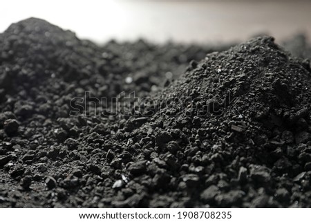 Heap of black coal, closeup view. Mineral deposits