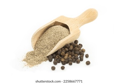 Heap of black pepper, peppercorns in spoon with milled powder isolated on white background, dried spice peppercorn concept - Powered by Shutterstock