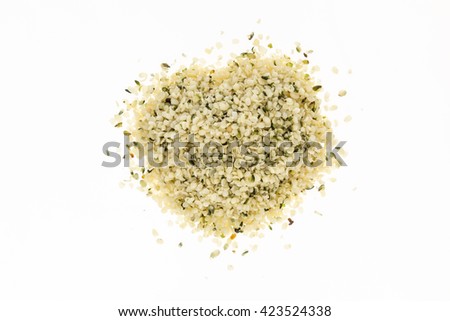 Heap of blanched hemp seeds , on white background