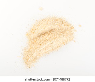 Heap of Bread Crumbs on White Paper Top View. Crushed Rusk Bread Crumbs or Panko Isolated