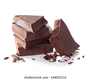 Heap Of Broken Pieces Of Chocolate On White Background