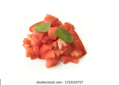 Heap Of Chopped Or Diced Tomatoes With Basil Isolated