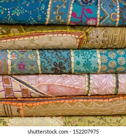 Heap Of Cloth Fabrics At A Local Market In India. Close Up .