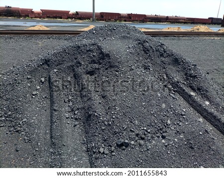 A heap of coal at a open air warehouse Stock photo © 