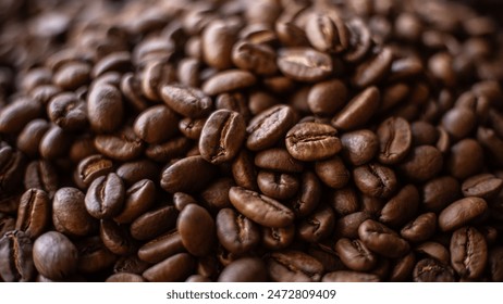 A heap of coffee beans stacked together, ready to be brewed into a delicious cup of coffee - Powered by Shutterstock