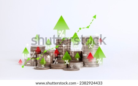 Heap of coins money with up arrow and stock market chart for financial banking increase interest rate or mortgage investment dividend from business growth concept.