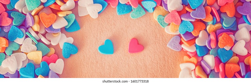 Heap Of Colorful Candies Confetti Of  Heart Shape. Valentine Day Holiday Concept. Toned With Retro Vintage Filters. Web Banner Header For Website. Blue And Pink Pair Couple Hearts Romantic Dating. 